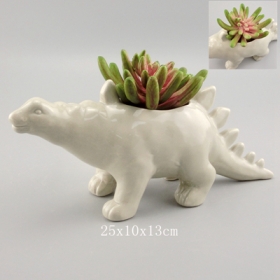 grijs aardewerk stegosaurus dinosaurus plantenbak met planten